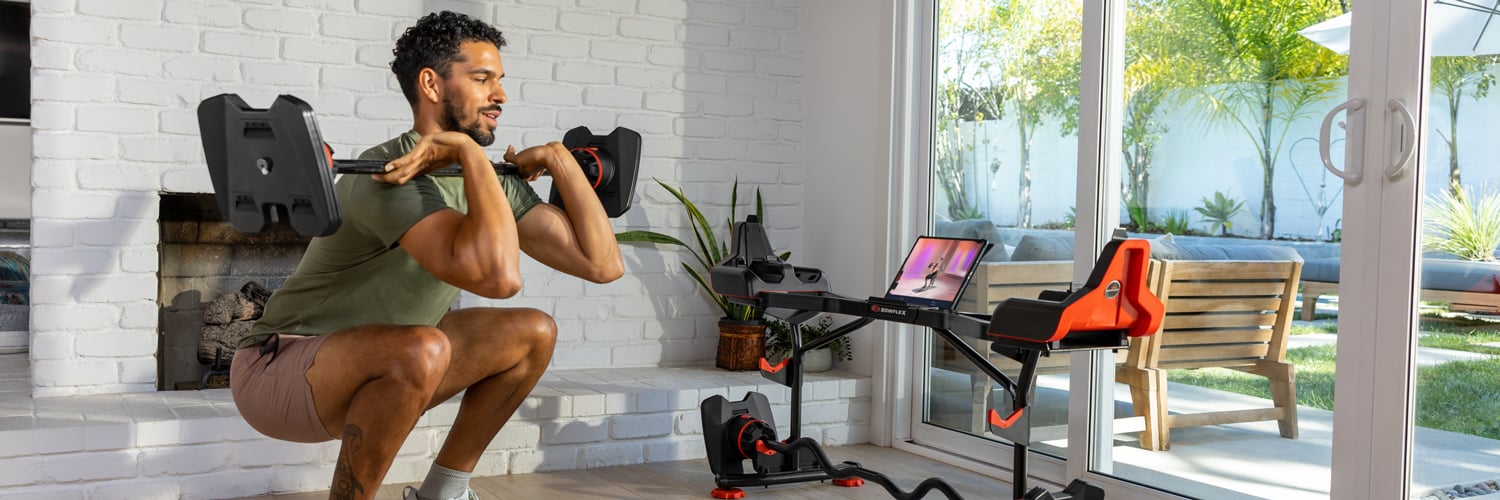Man doing barbell squats