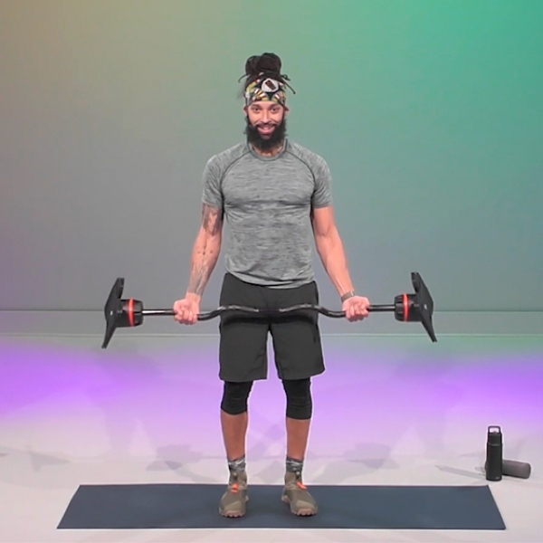 Male fitness trainer leads a barbell workout